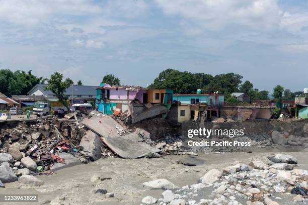 View of damaged houses due to a flash flood after heavy rain in Dhauladhar, at Village Chetru.