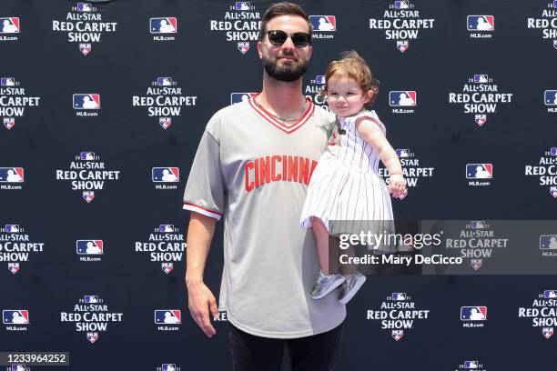 Jesse Winker of the Cincinnati Reds and a guest are seen during the MLB All-Star Red Carpet Show at Downtown Colorado on Tuesday, July 13, 2021 in...