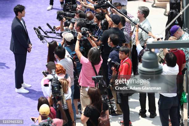 Shohei Ohtani of the Los Angeles Angels gives an interview during the MLB All-Star Red Carpet Show at Downtown Colorado on Tuesday, July 13, 2021 in...
