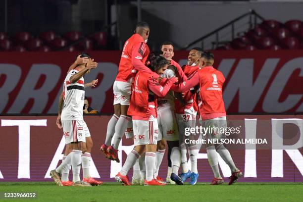 Brazil's Sao Paulo players celebrate after Vitor Bueno's goal against Argentina's Racing Club during the Copa Libertadores round of 16 first leg...