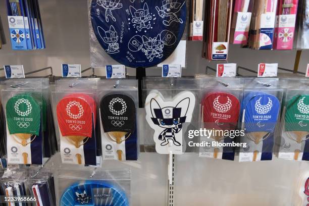 Paper fans and other merchandise for sale at a Tokyo 2020 Olympic Games official store in Tokyo, Japan, on Tuesday, July 13, 2021. The Tokyo Games...