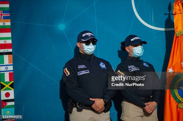 Officers of Interpol International police stand during a press conference were the high rank military and police members Major General of the...