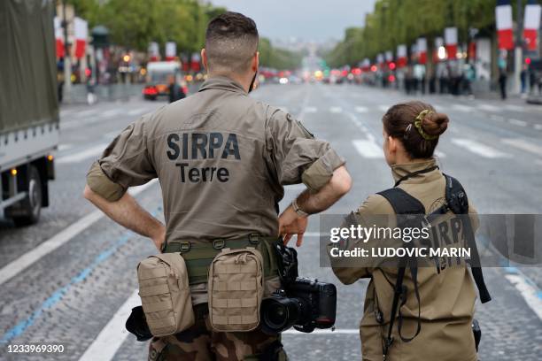 Soldiers of the 'Service d'informations et de relations publiques des armees' get ready prior to the annual Bastille Day military parade on the...