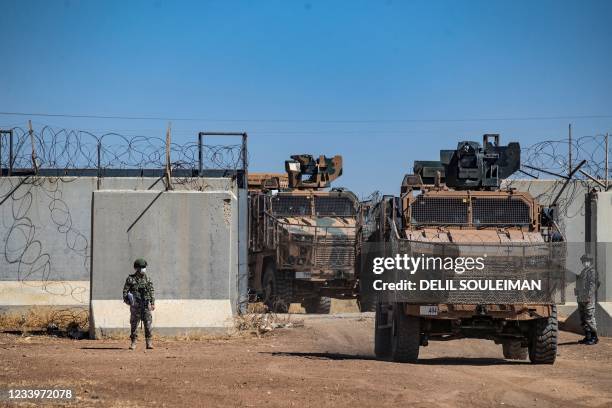 Turkish military vehicles enter Syria to take part in a joint patrol with Russian troops, in the countryside of the town of Derbassiye in Syria's...