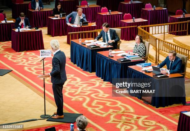 Geert Wilders , speaks as outgoing Prime Minister Mark Rutte , outgoing Minister of Medical Care Tamara van Ark and outgoing Minister of Health,...