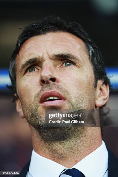 Gary Speed the Wales manager lines up for the national anthems before the UEFA EURO 2012 group G qualifying match between Wales and Montenegro at the...