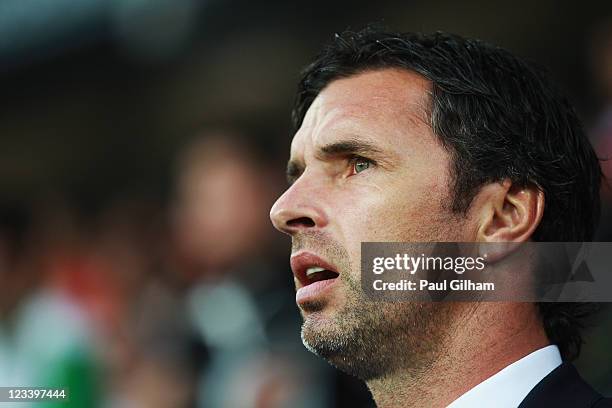 Gary Speed the Wales manager lines up for the national anthems before the UEFA EURO 2012 group G qualifying match between Wales and Montenegro at the...