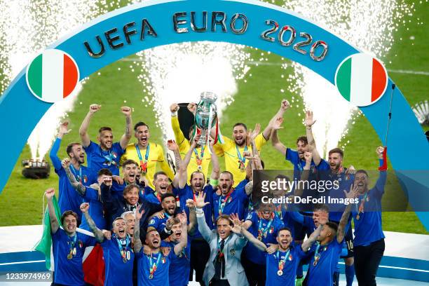 Players of Italy celebrate with the trophy after winning the UEFA Euro 2020 Championship Final between Italy and England at Wembley Stadium on July...