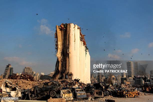 This picture taken on July 14, 2021 shows a partial view of the damaged grain silos at the port of Lebanon's capital Beirut, almost a year after the...