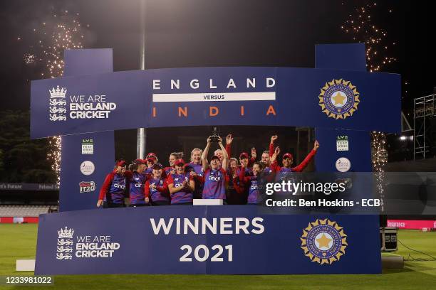The England team lift the overall series trophy during the Women's Third T20 International between England and India at Cloudfm County Ground on July...