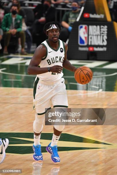 Jrue Holiday of the Milwaukee Bucks handles the ball against the Phoenix Suns during Game Four of the 2021 NBA Finals on July 14, 2021 at Fiserv...