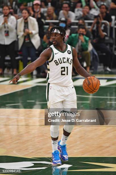 Jrue Holiday of the Milwaukee Bucks handles the ball against the Phoenix Suns during Game Four of the 2021 NBA Finals on July 14, 2021 at Fiserv...