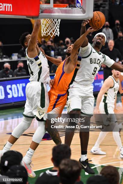 Bobby Portis of the Milwaukee Bucks blocks the shot of Cameron Payne of the Phoenix Suns during Game Four of the 2021 NBA Finals on July 14, 2021 at...