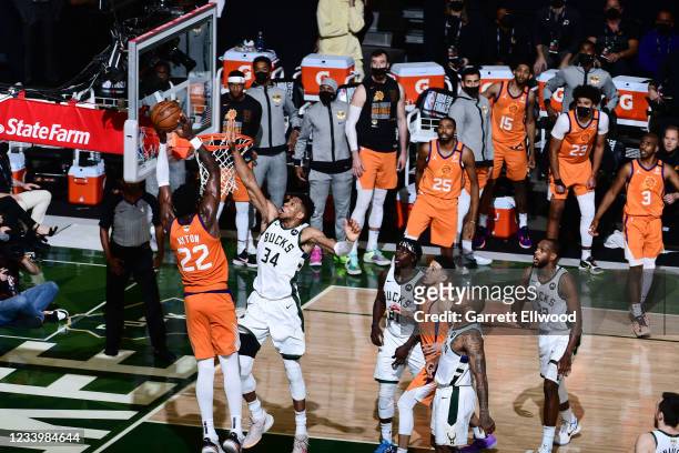 July 14: Giannis Antetokounmpo of the Milwaukee Bucks blocks the shot of Deandre Ayton of the Phoenix Suns during Game Four of the 2021 NBA Finals on...