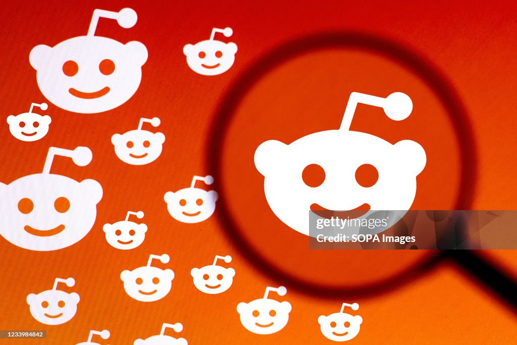 In this photo illustration the Reddit logo seen displayed on...