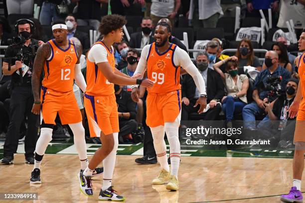 Cameron Johnson of the Phoenix Suns and Jae Crowder of the Phoenix Suns react during Game Four of the 2021 NBA Finals on July 14, 2021 at Fiserv...