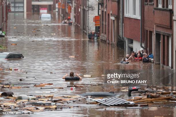 Woman is trying to move in a flooded street following heavy rains in Liege, on July 15, 2021. Illustration shows the scene in Liege after heavy...