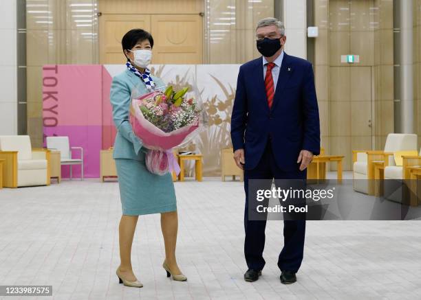 Tokyo Governor Koike Yuriko and International Olympic Committee President Thomas Bach pose for photographs prior to their meeting to discuss the...