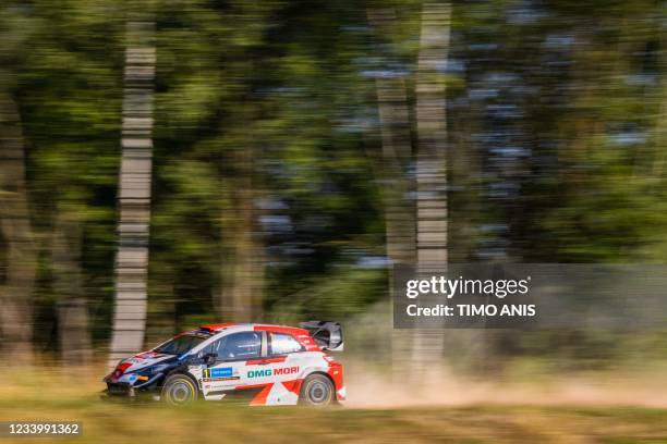 France's driver Sebastien Oguier and France's co-driver Julien Ingrassia steer their Toyota Yaris WRC car during the Shakedown Rally Start of the FIA...