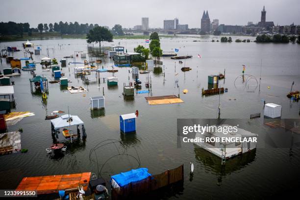 This aerial photograph shows partially submerged caravans and campers in flood waters at the camping site of De Hatenboer in Roermond on July 15,...