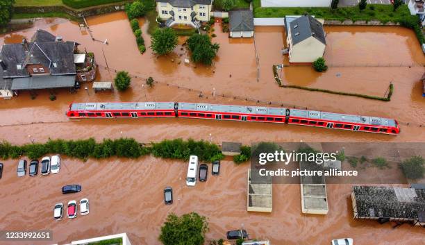 July 2021, Rhineland-Palatinate, Kordel: A regional train is in water at the local station. The power went out and the train came to a halt on...