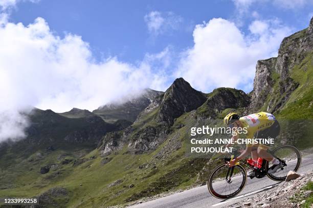 Team UAE Emirates' Tadej Pogacar of Slovenia wearing the overall leader's yellow jersey descends the Tourmalet pass during the 18th stage of the...
