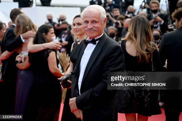 French photographer Yann Arthus-Bertrand arrives for the screening of the film "France" at the 74th edition of the Cannes Film Festival in Cannes,...