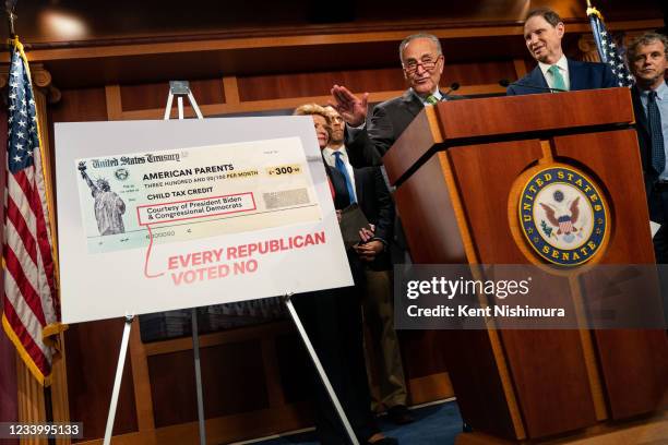 Senate Majority Leader Chuck Schumer , flanked by Senate Democrats, Sen. Debbie Stabenow , Sen. Cory Booker , Sen. Michael Bennet , Sen. Ron Wyden ,...