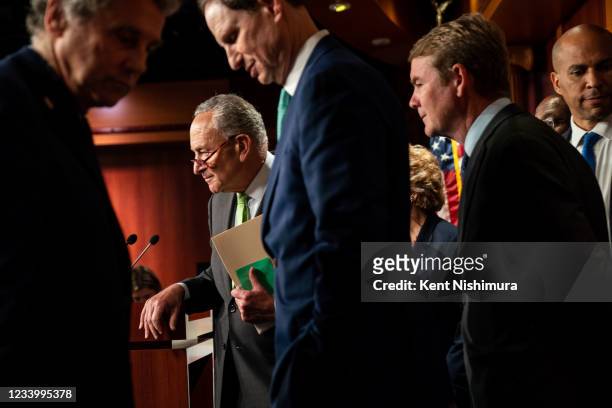 Senate Majority Leader Chuck Schumer second from left, and Sen. Sherrod Brown , Sen. Ron Wyden , Sen. Debbie Stabenow , Sen. Michael Bennet , Sen....