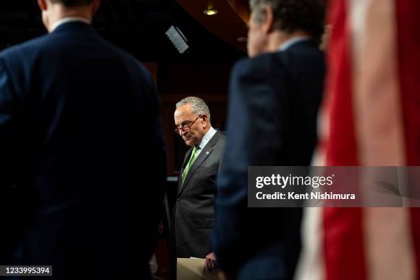 Senate Majority Leader Chuck Schumer , flanked by Senate Democrats, Sen. Debbie Stabenow , Sen. Cory Booker , Sen. Michael Bennet , Sen. Ron Wyden ,...