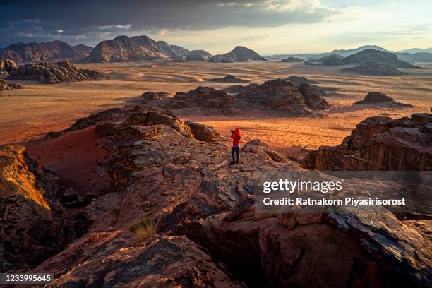 landscape red sand dune and strange shape mountain of wadi rum desert, jordan - aqaba stock pictures, royalty-free photos & images