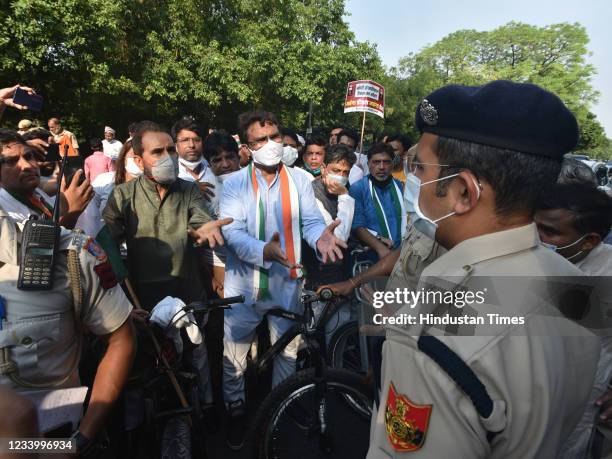 Police officers stop the Delhi Pradesh Congress Committee, president Ch. Anil Kumar, along with AICC In-charge of Delhi Congress Shakti Sinh Gohil...