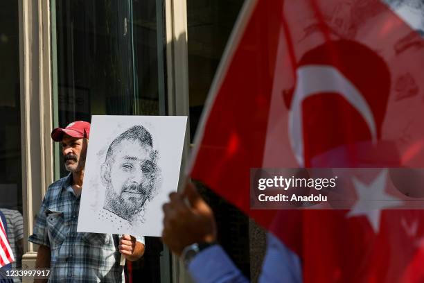 Demonstrators hold pictures of people, who lost their lives in July 15 failed coup attempt in Turkey executed by the Fetullah Terrorist Organization...