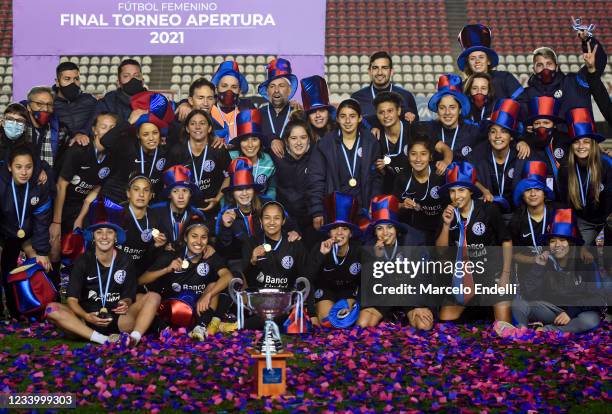 Players of San Lorenzo pose with the trophy after winning the final match of the Argentina Women's First Division Tournament between Boca Juniors and...