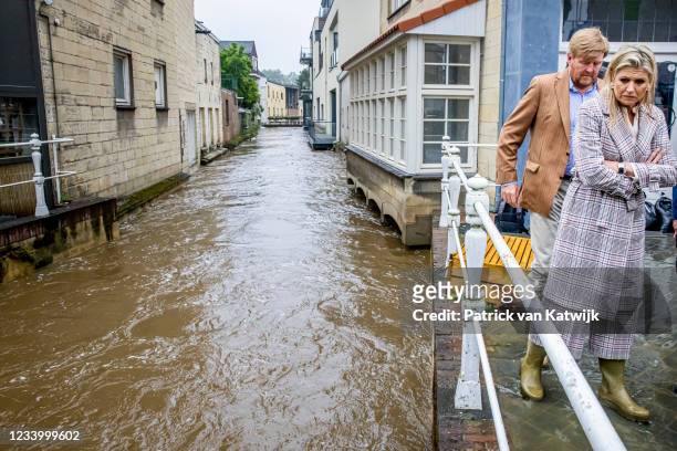 King Willem-Alexander of The Netherlands and Queen Maxima of The Netherlands inspect the damage caused by extreme flooding on July 15, 2021 in...