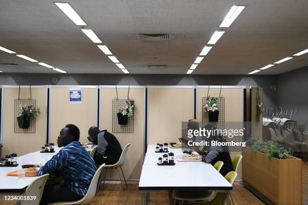 Members of the South Sudanese track-and-field team eat lunch at a cafeteria in the basement of Maebashi city hall in Maebashi, Gunma Prefecture,...