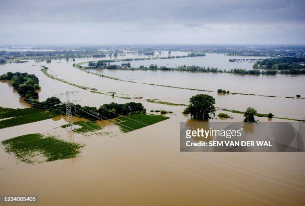 An ariel view shows the high water level near the Limburg hamlet of Aasterberg as the Meuse floods its banks following heavy rains on July 16, 2021....