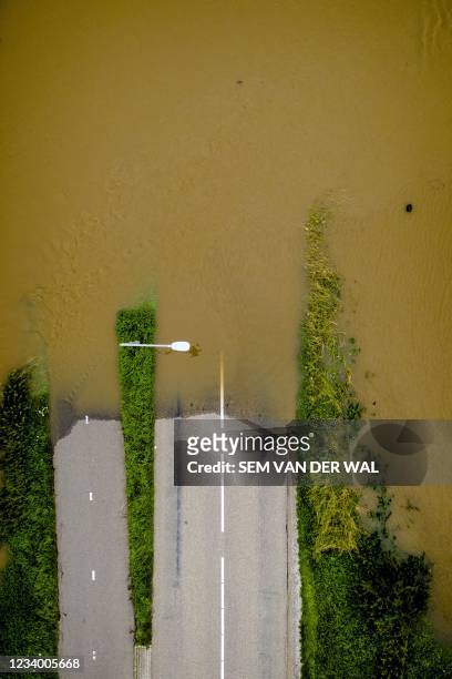 An ariel view shows the high water level near the Limburg hamlet of Aasterberg after the Meuse broke its banks following heavy rains on July 16,...