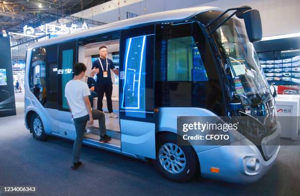 Driverless AR bus and AI intelligent car developed by SenseTime are unveiled at the World Conference on Artificial Intelligence in Shanghai, China,...