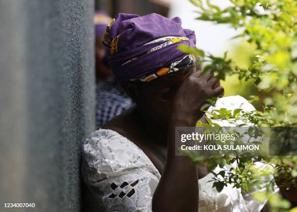 One of the parents of the abducted students of Bethel Baptist High School sit inside the school premises to pray for the return of their children...