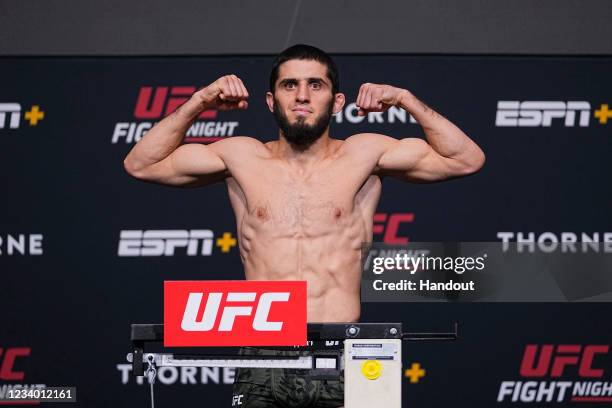 In this UFC handout, Islam Makhachev poses on the scale during the UFC Fight Night weigh-in at UFC APEX on July 16, 2021 in Las Vegas, Nevada.