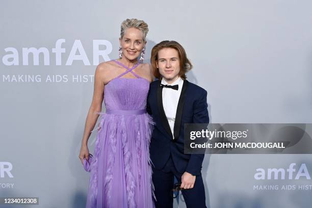 Actress Sharon Stone and her son Roan Joseph Bronstein arrive on July 16, 2021 to attend the amfAR 27th Annual Cinema Against AIDS gala at the Villa...