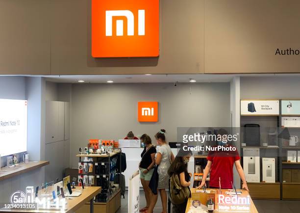 Xiaomi logo is seen on the store in Krakow, Poland on July 16, 2021. Xiaomi overtakes Apple in the global smartphone sales.
