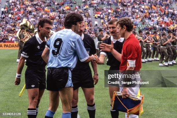 Enzo Francescoli of Uruguay, Helmut Kohl, referee and Emilio Butragueno of Spain during the FIFA World Cup match between Uruguay and Spain, at Stadio...