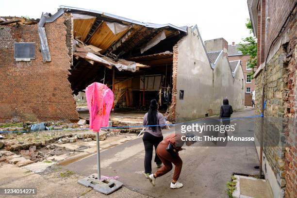 People clean houses and streets following a severe storm on July 16, 2021 in in Ensival, Belgium. A severe storm and heavy rainfall has caused the...