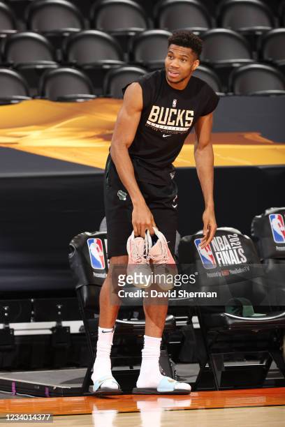 Giannis Antetokounmpo of the Milwaukee Bucks looks on during practice and media availability as part of the 2021 NBA Finals on July 16, 2021 at...