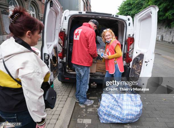 The Belgium Red Cross brings first aids to people following a severe storm on July 16, 2021 in the 'Rue Val-Benoit' in Angleur, a district from...