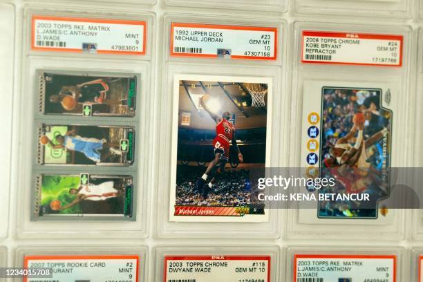Star Michael Jordan cards are displayed at Bleecker Trading in New York on July 06, 2021. - Inside an unassuming store in New York's Greenwich...