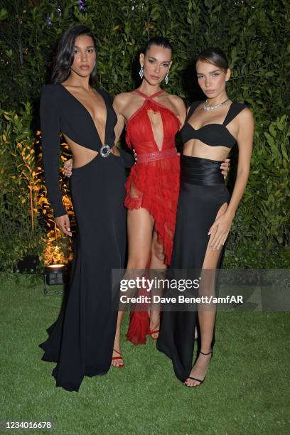 Chiara Sampaio, Marianne Fonseca and Hana Cross attend the amfAR Cannes Gala 2021 at Villa Eilenroc on July 16, 2021 in Cap d'Antibes, France.