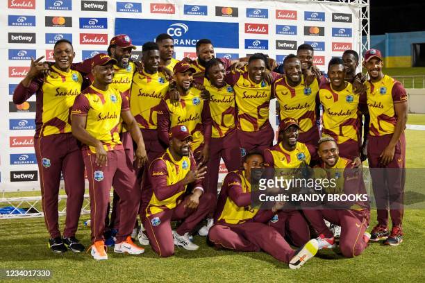 West Indies players celebrate with the winning trophy at the end of the 5th and final T20I between Australia and West Indies at Darren Sammy Cricket...
